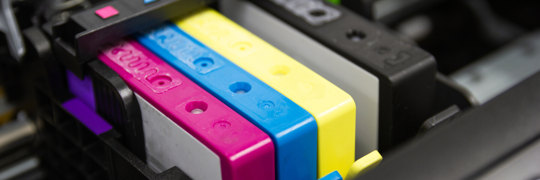 closeup of ink cartridges in an inkjet printer