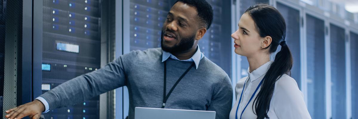 IT professionals checking a rack of servers